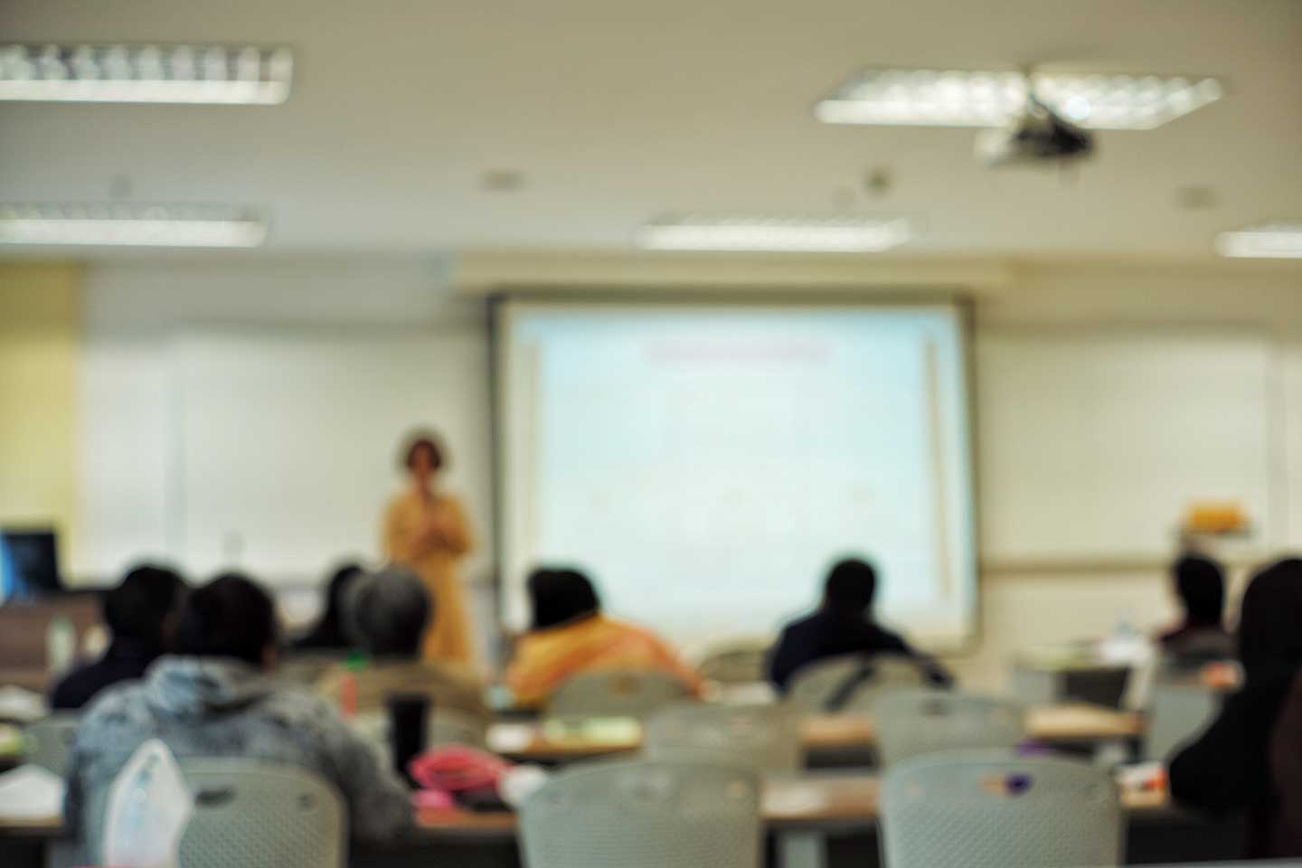 classroom-with-blurred-crowded-students-and-teache