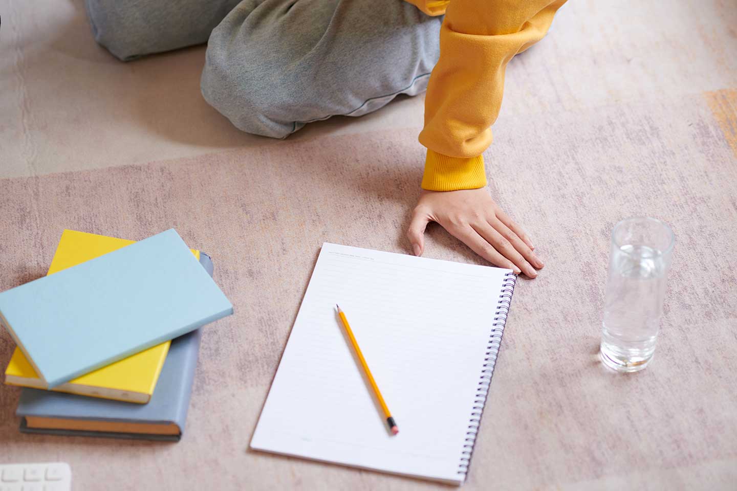 notebook-and-pencil-on-the-floor